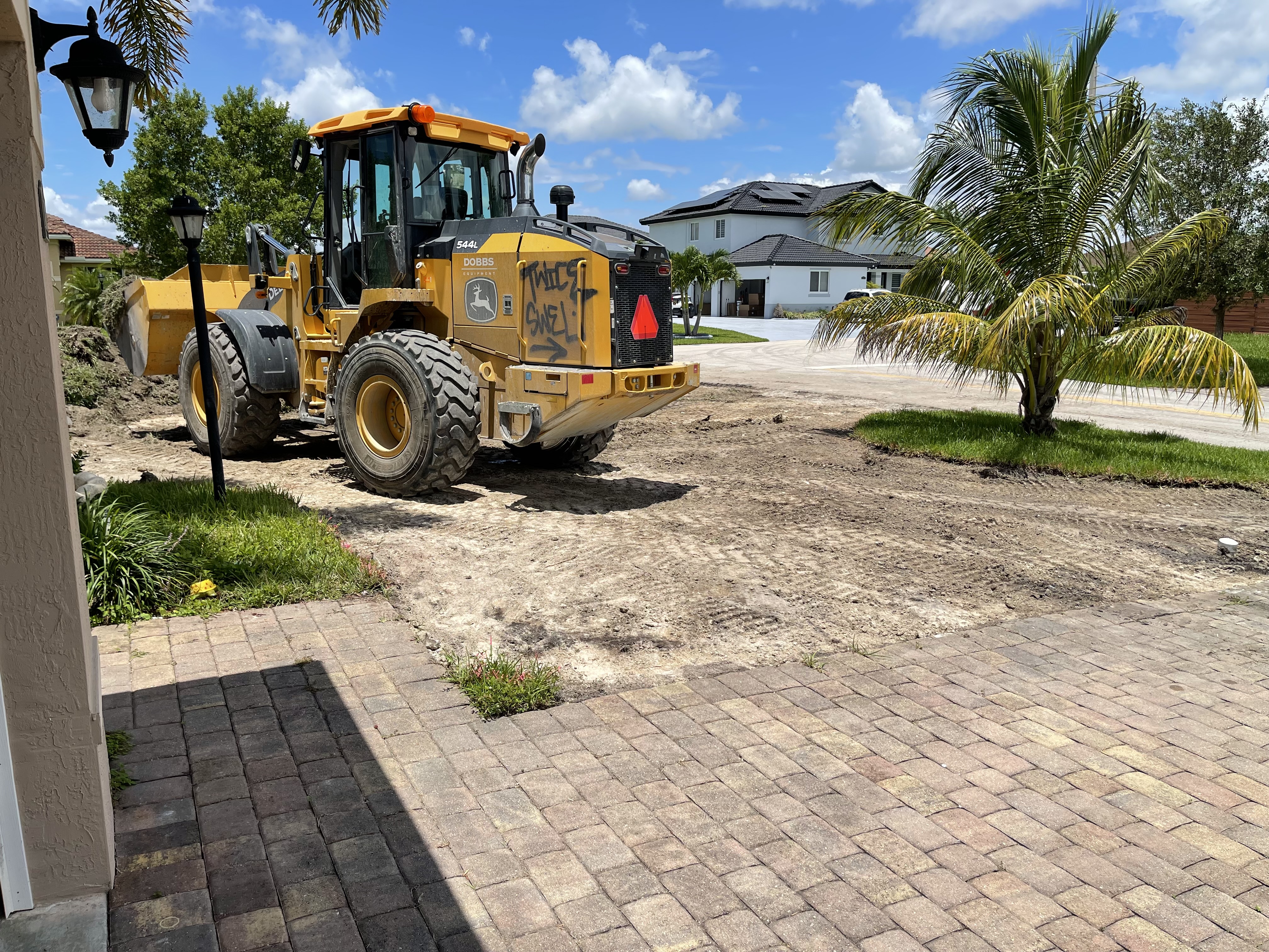 Existing paver driveway being removed