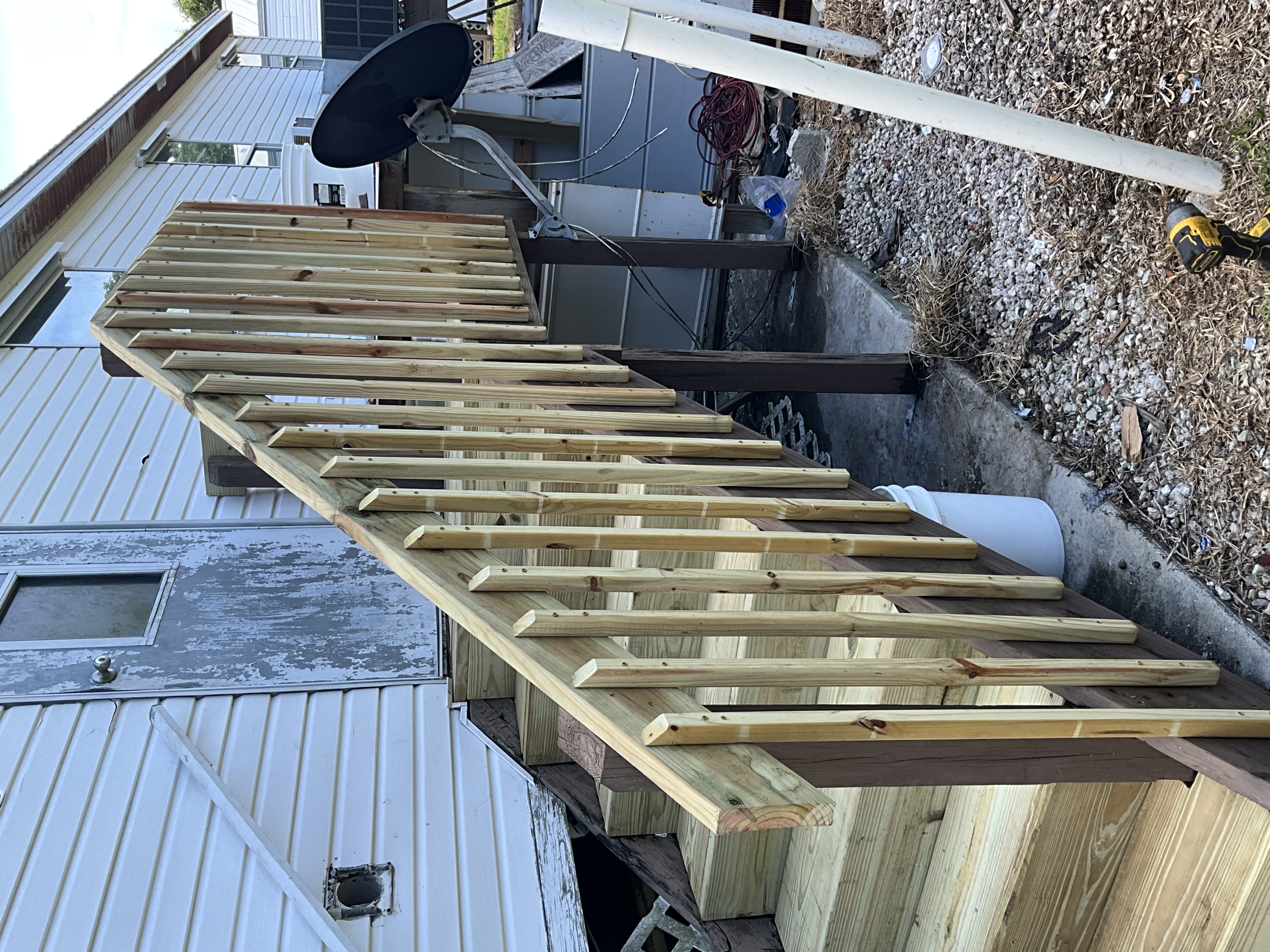 New exterior stair and railing components being installed