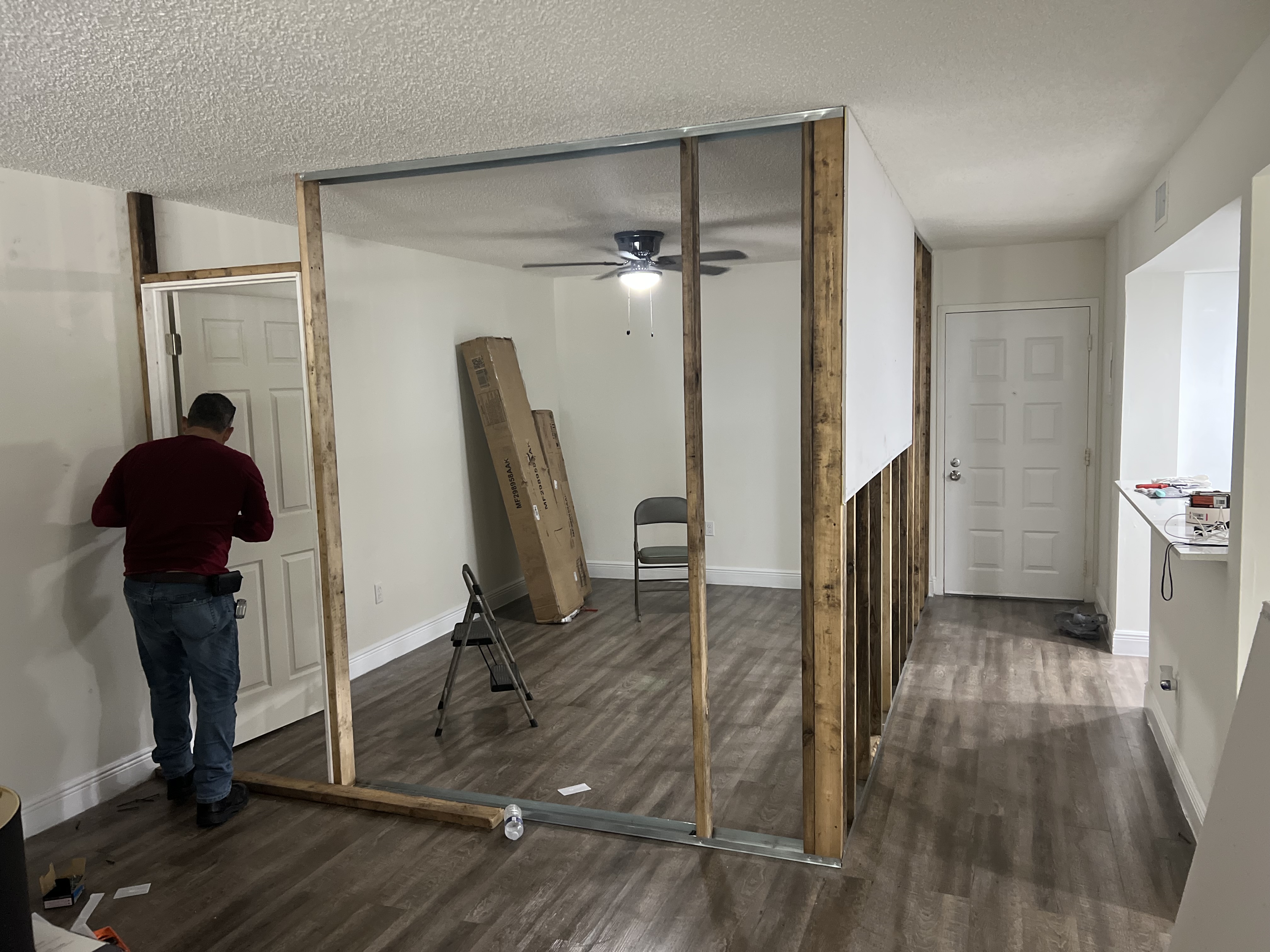 Drywall installation during living room conversion